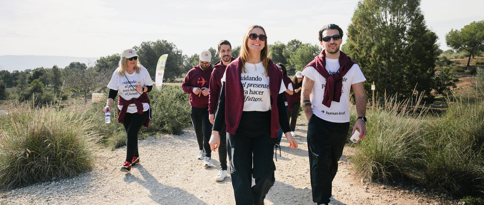 Human Level employees walking at a meet-up on a sunny day
