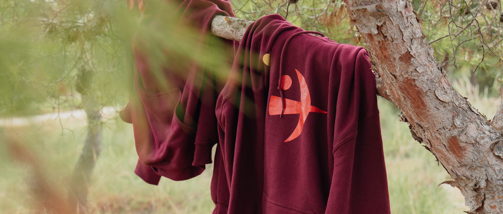 Human Level hoodies hanging from a tree