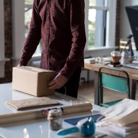 Man preparing a package for his e-commerce business